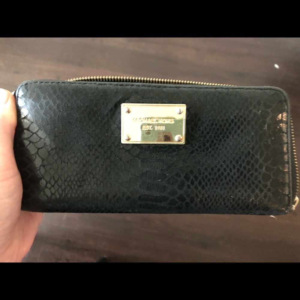 Michael Kors Black (snake like) leathery wallet. Minimal use.EUC